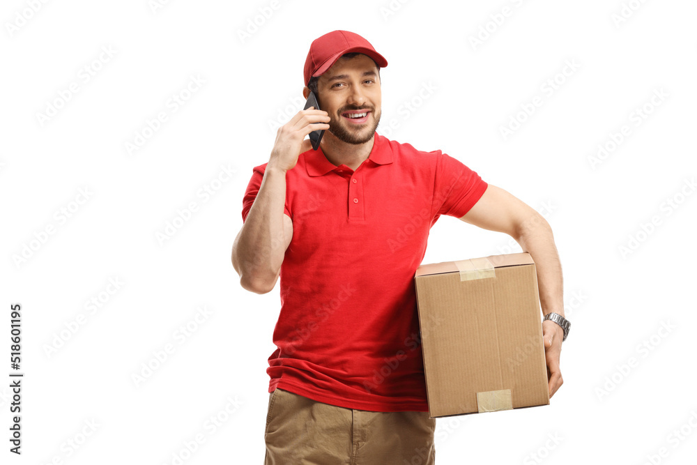 Delivery man holding a package and using a phone Delivery man holding a package and using a phone