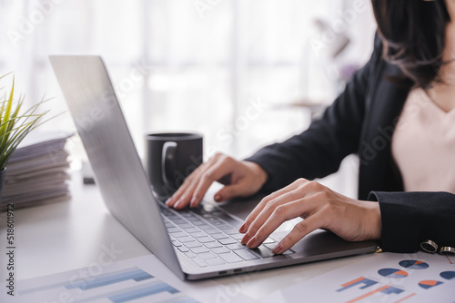 office girl's hands typing input data.