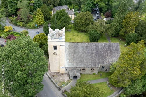 Bird's eye view of the St. Oswald's Church, Grasmere surrounded by green trees in England photo