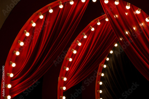 Red curtain background with bulbs