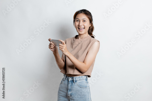 Beautiful Asian woman gesturing for advertisement editing on isolated background, portrait concept used for advertisement and signage, isolated over white background, copy space.