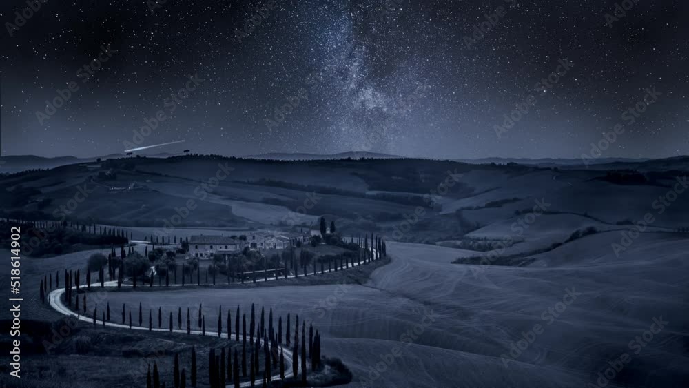 Milky way and winding road with cypressesin Italy, timelapse