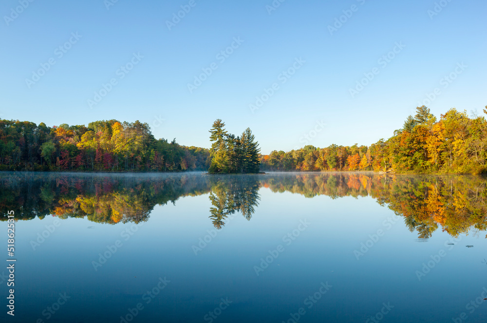 Panorama of beautiful calm lake in northern Minnesota on an autumn morning