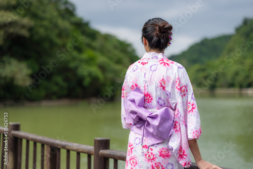Japanese woman wear yukata at outdoor park © leungchopan