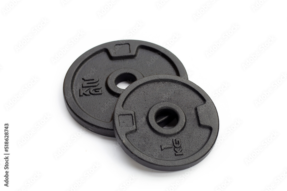 Black weight plates on white background. Gym equipment Black weight plates on white background. Gym equipment