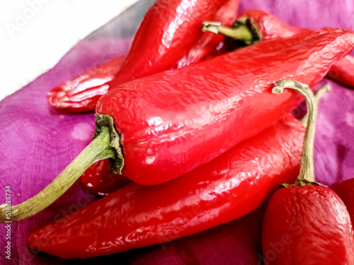 Thick Big Fresh red chilly vegetable. Hot red cayenne pepper or Jalepeno chili used to make Indian Pickle. Lal Achari Mirch