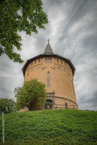 Vertical low angle shot of the Pildammstornet gallery in Malmo, Sweden against a cloudy sky photo