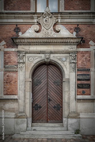 Vertical shot of the door of the magnificent Tranchell house in Landskrona, Sweden. photo