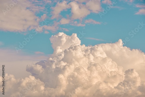 Aesthetic wallpaper with fluffy big clouds in the blue sky photo