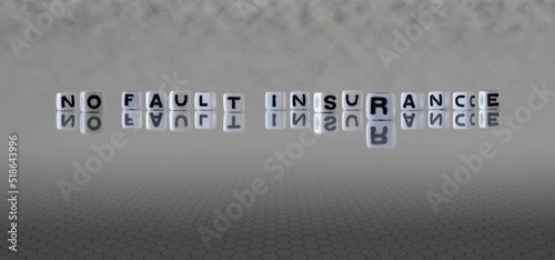 no fault insurance word or concept represented by black and white letter cubes on a grey horizon background stretching to infinity