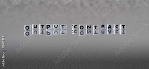 output contract word or concept represented by black and white letter cubes on a grey horizon background stretching to infinity