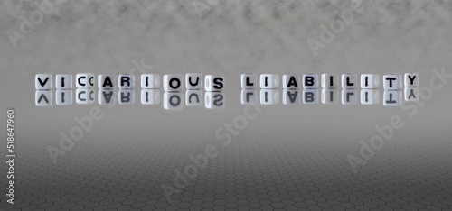 vicarious liability word or concept represented by black and white letter cubes on a grey horizon background stretching to infinity photo