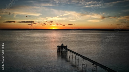 Aerial view of the Clevedon Pier over the water under a sunset sky photo