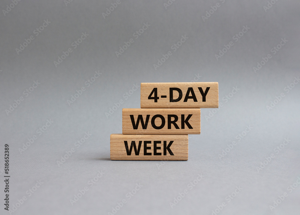4-day work week symbol. Concept words 4-day work week on wooden blocks. Beautiful grey background. Business and 4-day work week concept. Copy space 4-day work week symbol. Concept words 4-day work week on wooden blocks. Beautiful grey background. Business and 4-day work week concept. Copy space