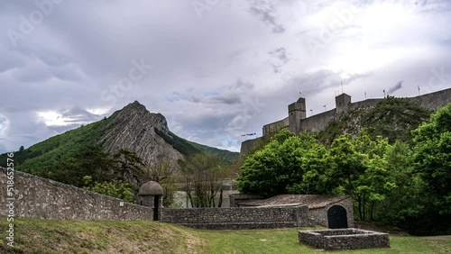 Time lapse footage of the Citadelle de Sisteron in France inder a gloomy sky photo