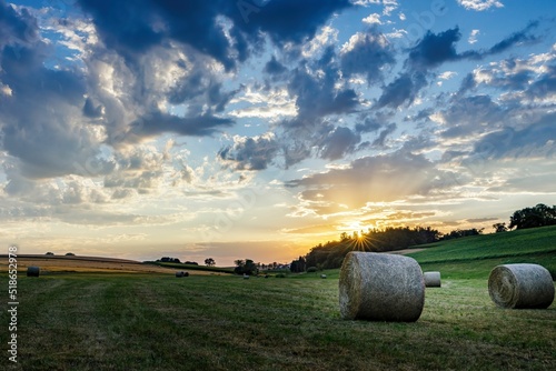 bale of straw in sunset photo