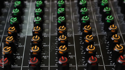 Closeup shot of orange, green, and red aux switches on a board