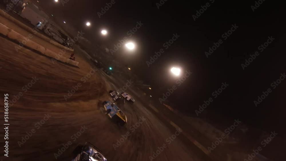Sprint Car Race Cars Racing around the Auto club speedway dirt track