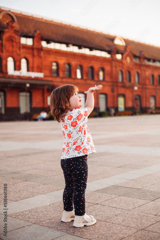 little girl confused on the street in summer little girl confused on the street in summer