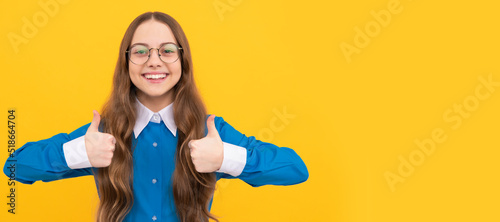 Get education, get satisfaction. Happy teen girl give thumbs ups. Satisfaction hand gesture. Be satisfied. Child face, horizontal poster, teenager girl isolated portrait, banner with copy space.