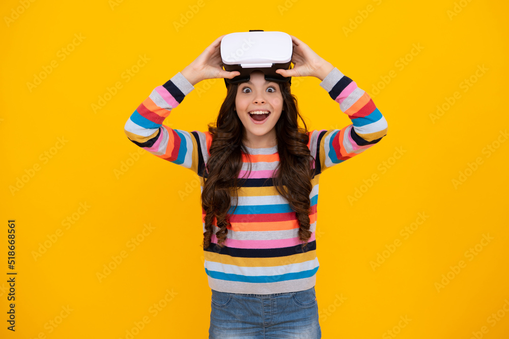Excited teenager using VR headset. Kid play vr video game. Digital future and innovation. Child in virtual goggles. Excited teen girl with virtual reality goggles headset isolated on yellow. Excited teenager using VR headset. Kid play vr video game. Digital future and innovation. Child in virtual goggles. Excited teen girl with virtual reality goggles headset isolated on yellow.