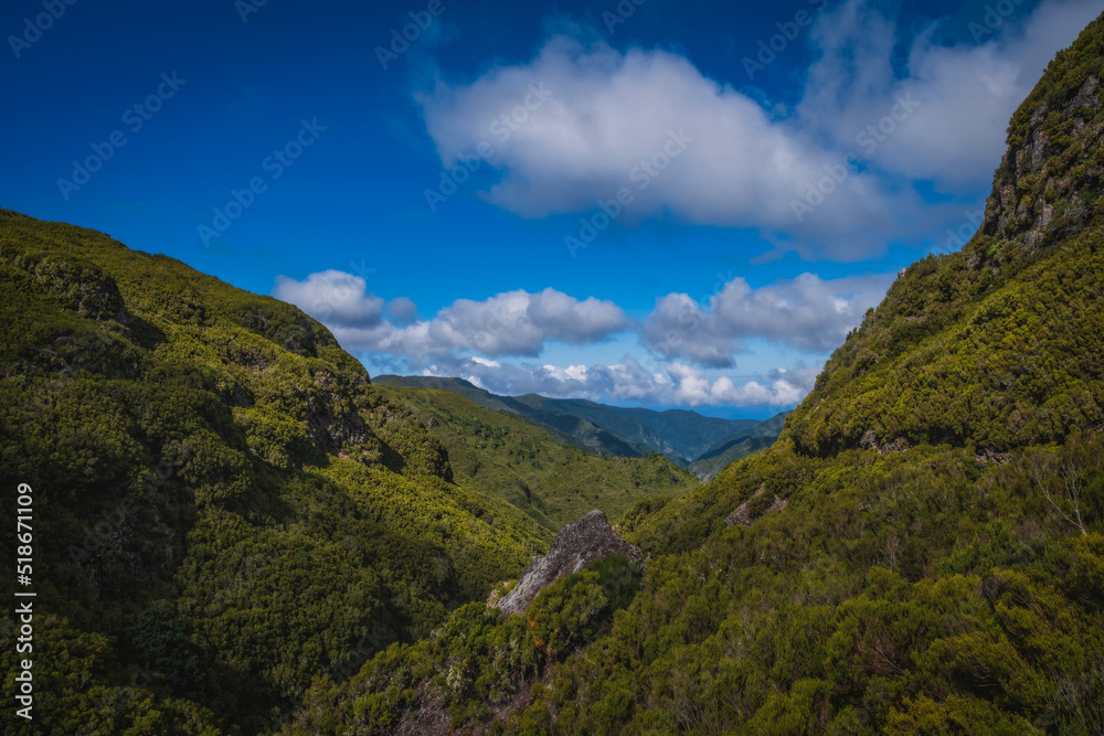 Hiking Levada trail 25 Fontes in Laurel forest - Path to the famous Twenty-Five Fountains in beautiful landscape scenery - Madeira Island, Portugal. October 2021.