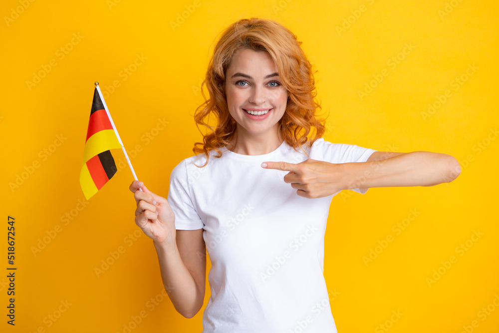 Happy woman holding flag of Germany, immigration and travelling in Europe. Germany flag, cheering democratic laws, human rights freedoms in Germany. Deutschland, deutsche flag. Happy woman holding flag of Germany, immigration and travelling in Europe. Germany flag, cheering democratic laws, human rights freedoms in Germany. Deutschland, deutsche flag.