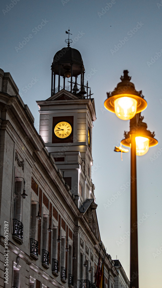 romantic clock tower at night with cozy lights