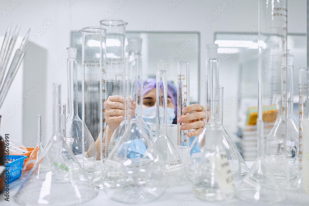 A girl scientist checks a sample for research A girl scientist checks a sample for research