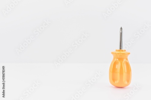 Schilderij op canvas screwdriver isolated on a white table with copy space