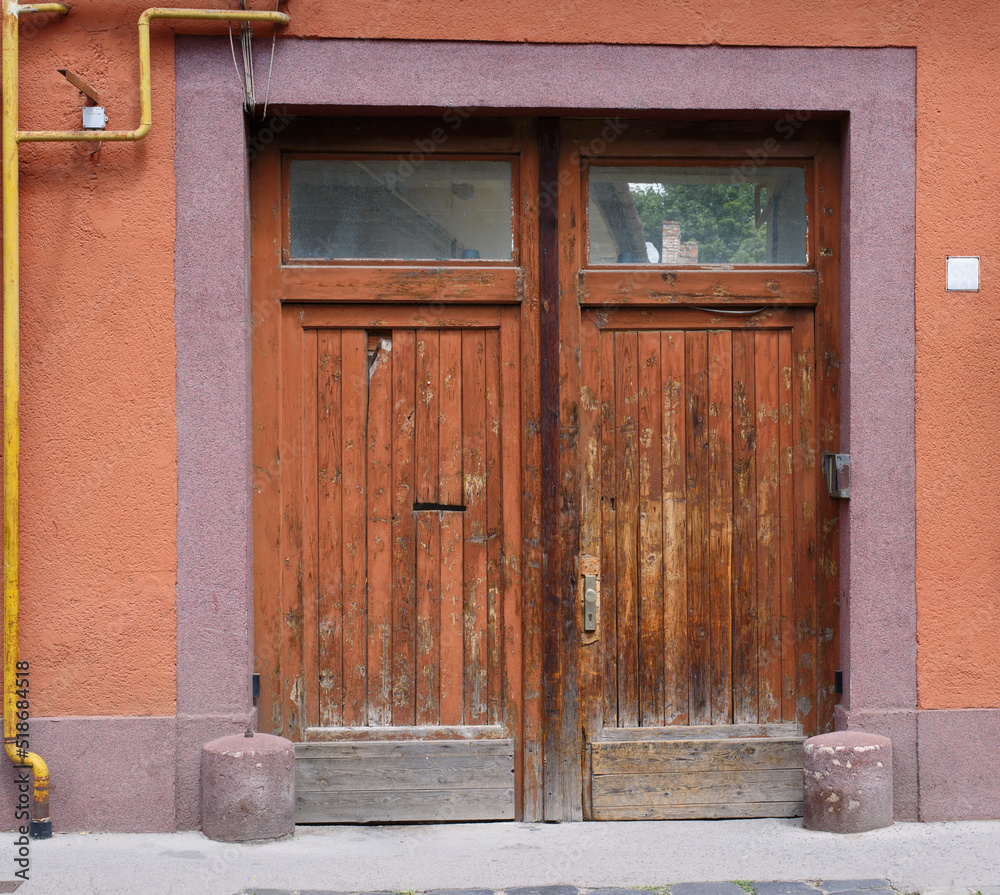 Front of the old building (facade), historic wooden door (gate). Architecture - Hungary.