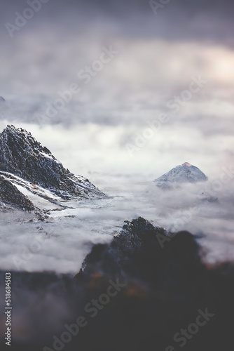 Mountain landscape. Mountain tops in fog. Fantasy landscape, mountain rocks. 3D illustration.
