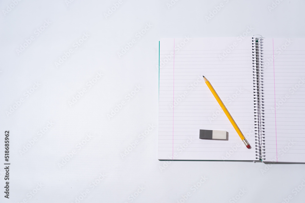school equipment on blank notebook school equipment on blank notebook