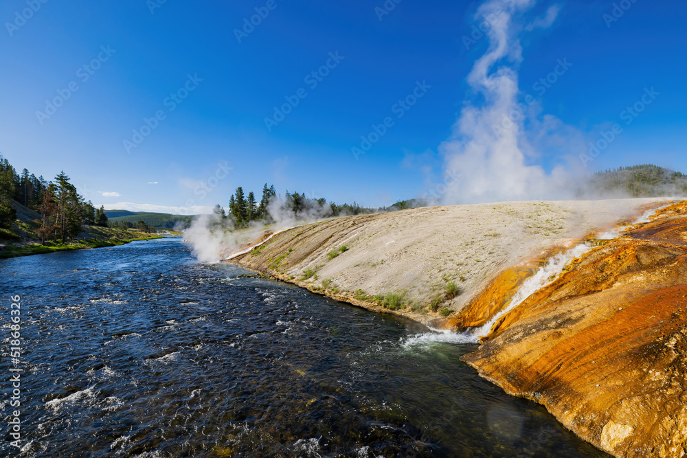 Sunny view of beautiful landscape along Firehole River Sunny view of beautiful landscape along Firehole River