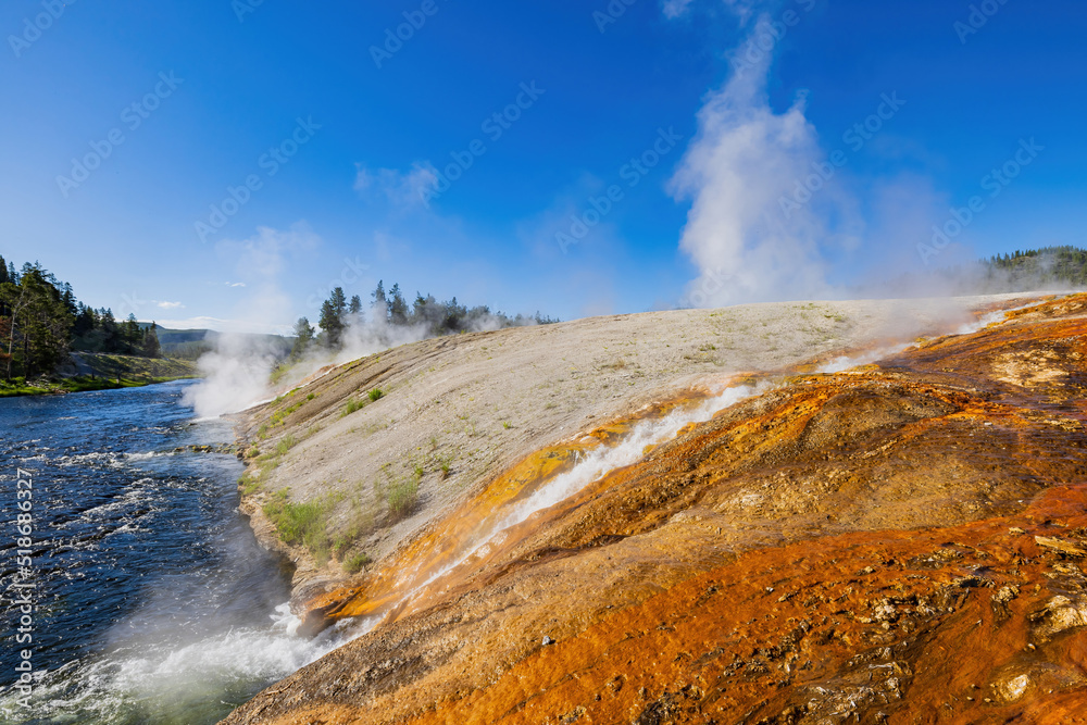 Sunny view of beautiful landscape along Firehole River