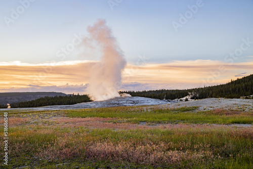 Sunset view of the Old Faithful geyser