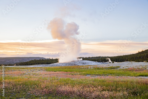 Sunset view of the Old Faithful geyser