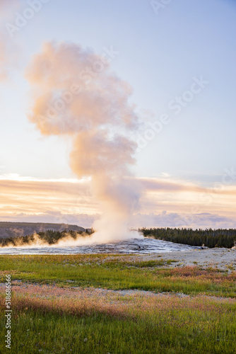 Sunset view of the Old Faithful geyser