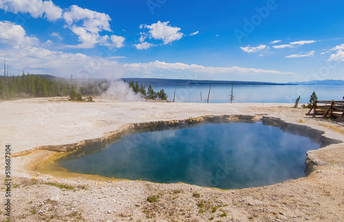 Sunny beautiful landscape of Abyss Pool in West Thumb of Yellowstone National Park