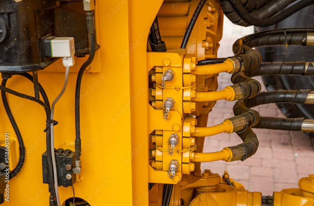 Hydraulics pipes and nozzles, tractor or other construction equipment. focus on the hydraulic