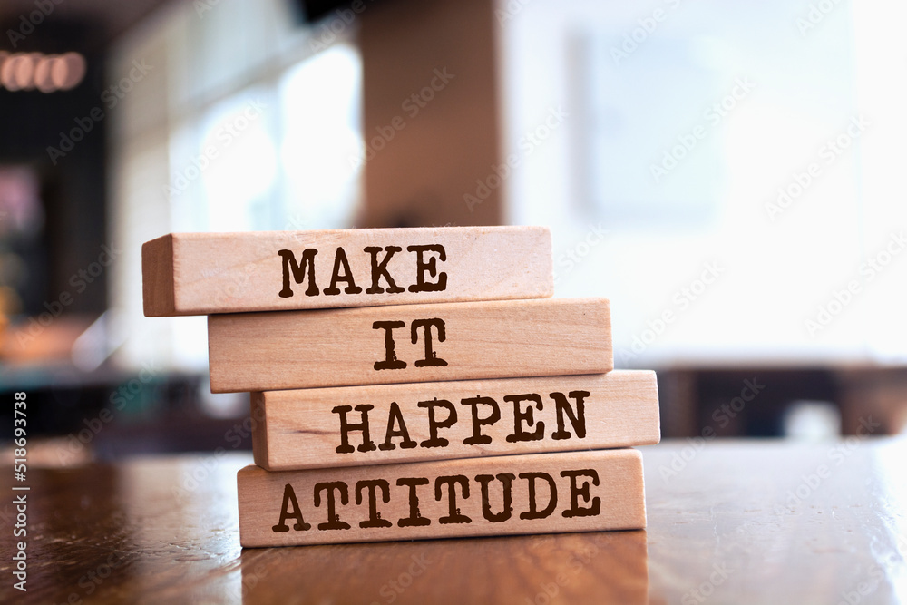 Wooden blocks with words 'MAKE IT HAPPEN ATTITUDE'. Wooden blocks with words 'MAKE IT HAPPEN ATTITUDE'.