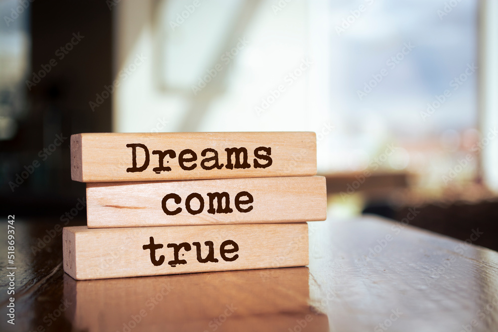 Wooden blocks with words 'Dreams come true'. Wooden blocks with words 'Dreams come true'.