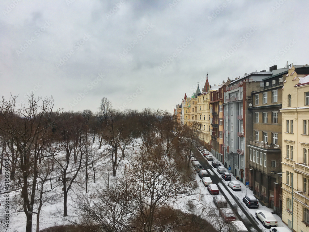 Buildings and Park in snowy winter at Prague