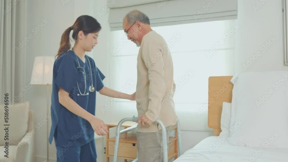 Asian nurse, doctor woman assisting old man, woman walking with senior man with mobility walker to bed in living area of nursing home senior daycare center Asian nurse, doctor woman assisting old man, woman walking with senior man with mobility walker to bed in living area of nursing home senior daycare center