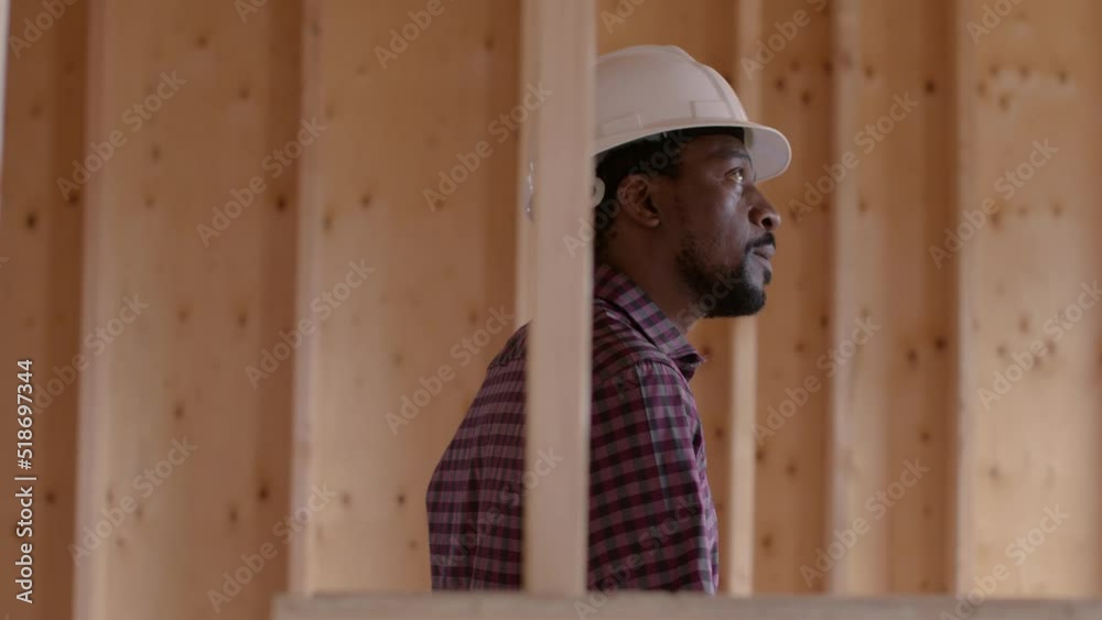 An African American architect working on his dream home. An African American architect working on his dream home.