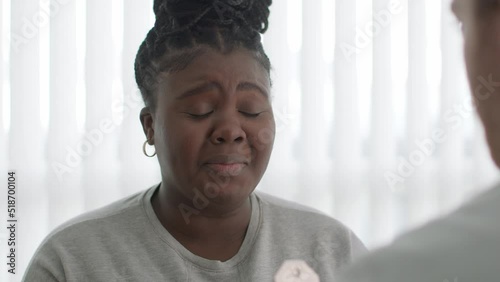 Young patient receives some bad news from her doctor and has an emotional reaction.