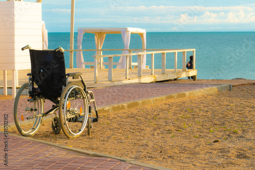 Locker room holiday beach sea wheelchair disabled happy travel family lifestyle, concept vacation summer for adult and sunrise chair, special people. Boy care love,