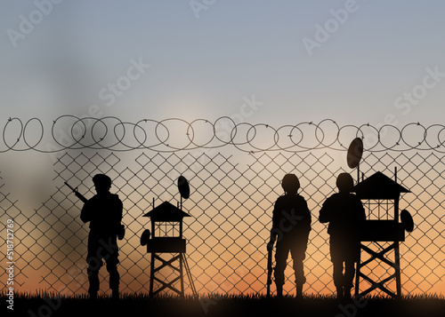 Εκτύπωση καμβά Silhouettes of border guards at post outdoors in evening