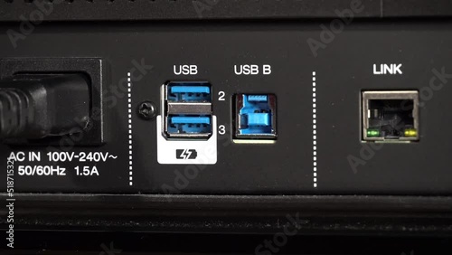 Disconnecting USB B cable froma a DJ mixer photo