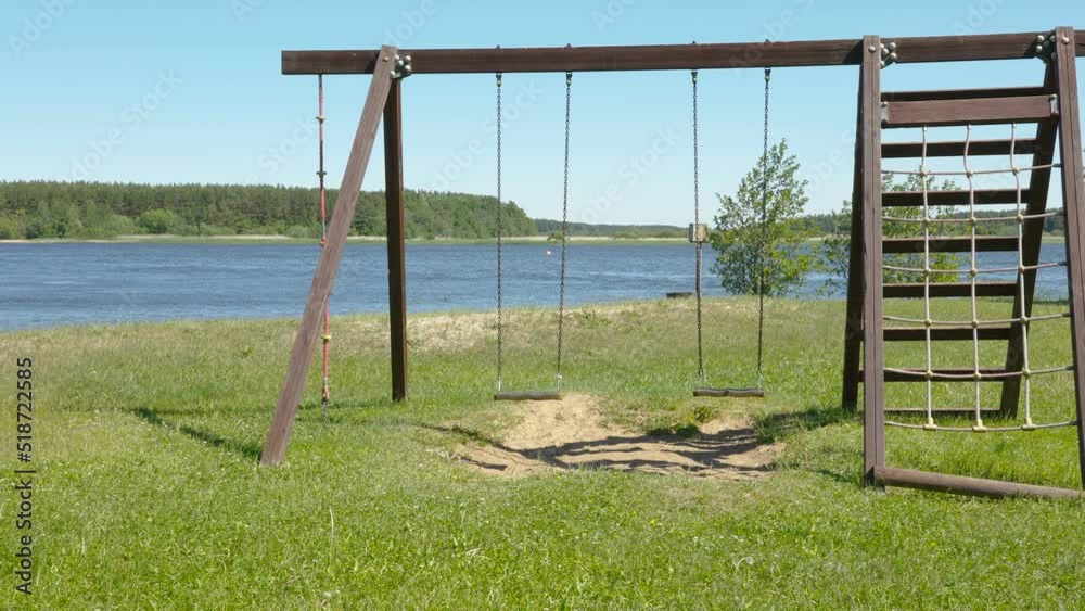 The playground with the swing and the ropes near the ocean on a hot sunny day in Estonia The playground with the swing and the ropes near the ocean on a hot sunny day in Estonia